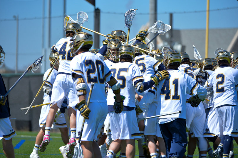 Notre Dame piles onto Jack Near – who scored the unassisted, game-winning goal in double-overtime – giving the Fighting Irish a shot to overtake Syracuse as the top-ranked team in the country.