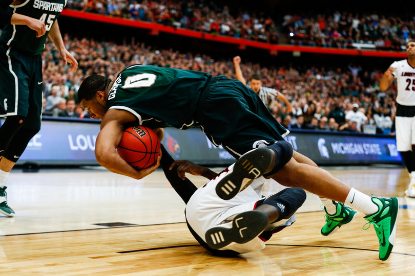 MSU's Marvin Clark Jr. tumbles for the ball after going for a rebound in the paint.