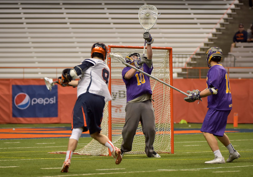 Junior midfielder Tim Barber takes a shot on Great Danes goalie Blaze Riorden.