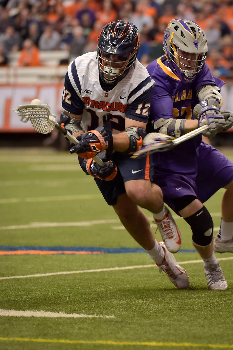 Junior midfielder Derek DeJoe pries the ball away from an Albany player.