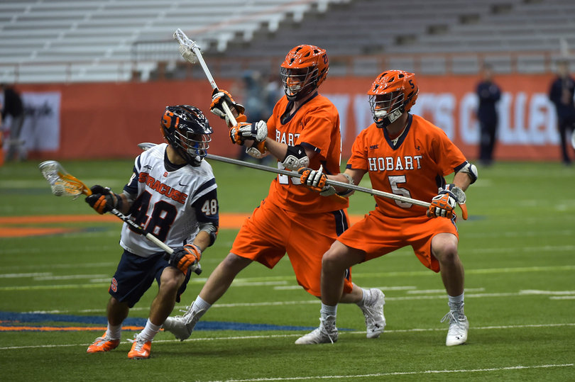 Midfielder Sergio Salcido evades two Hobart defenders.