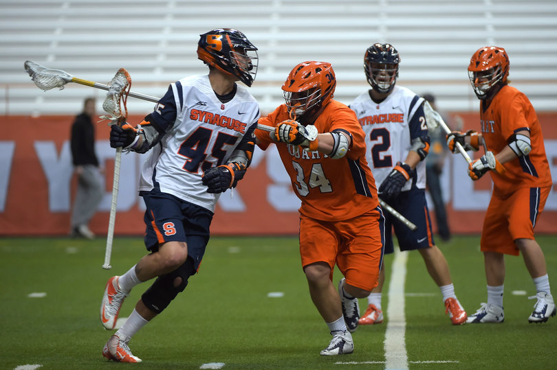 Staats cradles the ball as he tries to get past a Hobart defender. 