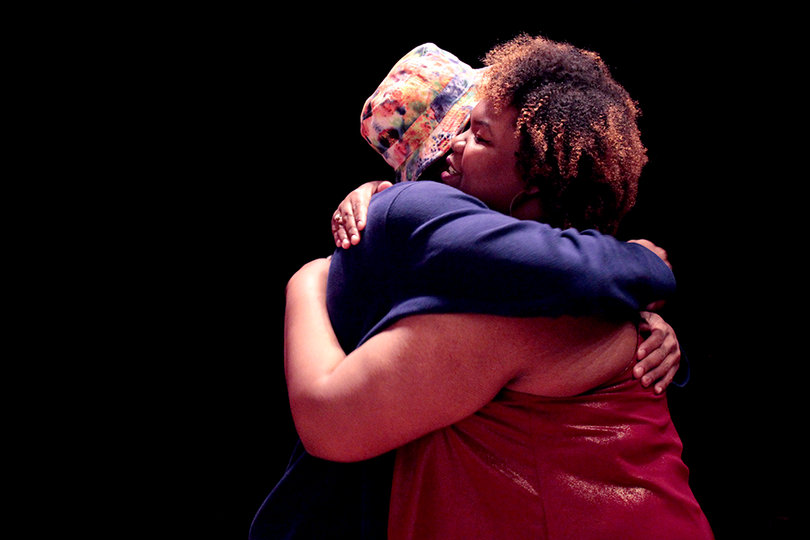 Roberts hugs a member of the audience at her motivational speech. Attendees lined up to meet her. 