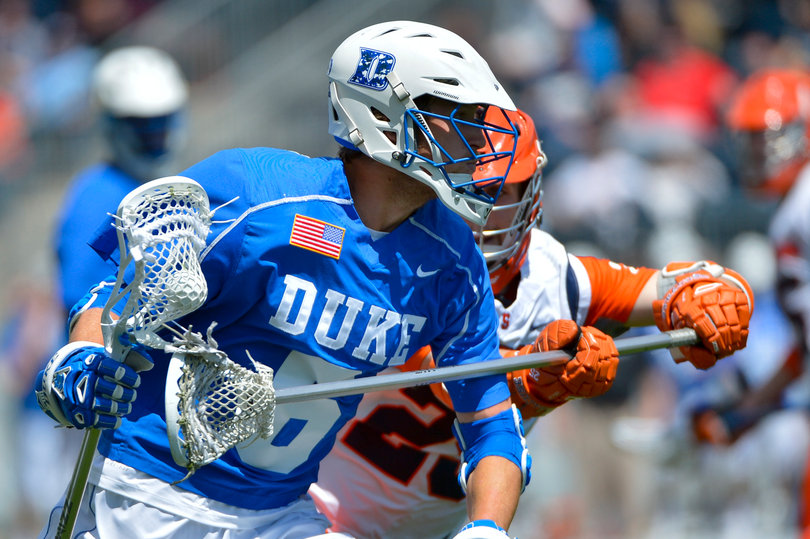 Duke's Will Haus scans the field with an SU pole defending him.