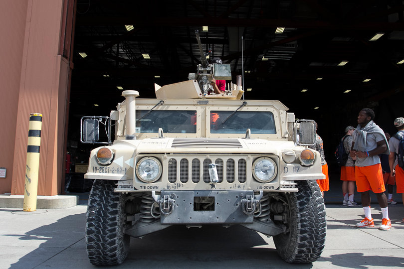 Shyheim Cullen looks on at one of the humvees on Tuesday morning. 