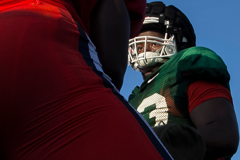 Freshman offensive guard Evan Adams prepares to attack his opponent Amir Ealey.