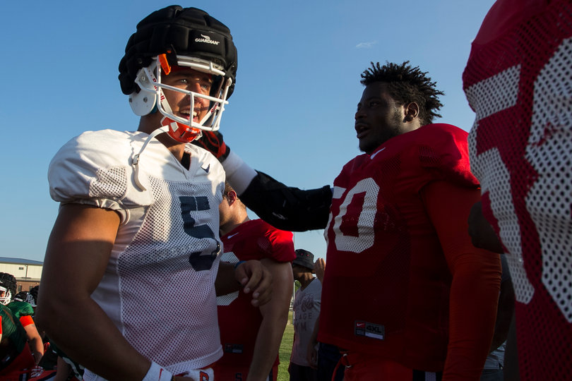 Wilson receives pats on the back from teammates after his fight with Dungey.