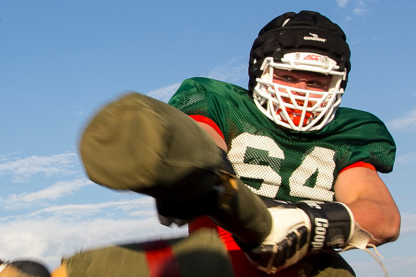 Freshman offensive tackle Colin Byrne swings at freshman defensive end Jake Pickard.