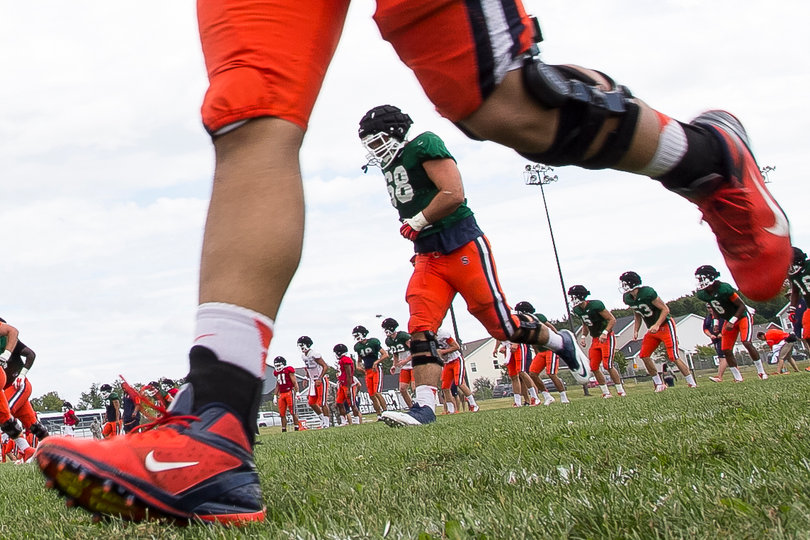 Senior offensive guard Nick Robinson (68) jogs after practice.
