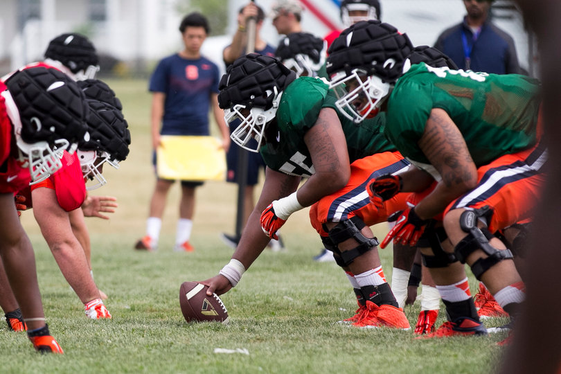 Senior center Rob Trudo gears up to snap the ball to the quarterback.