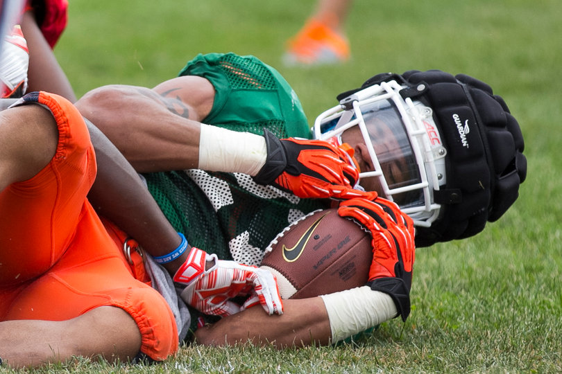 Junior running back George Morris lays on the ground after getting tackled.