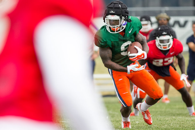 Estime runs with the ball en route to one of his two touchdowns during Thursday's scrimmage.