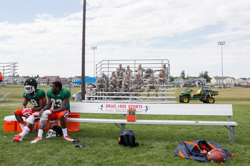 Wide receivers Steve Ishmael (8) and Sean Avant (83) sit on the bench with ice. Ishmael was icing his left knee while Avant iced his right.