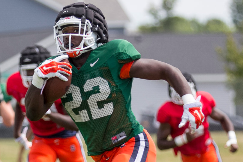 Freshman running back Jordan Fredericks holds the ball high and tight, as coaches have stressed in practice.