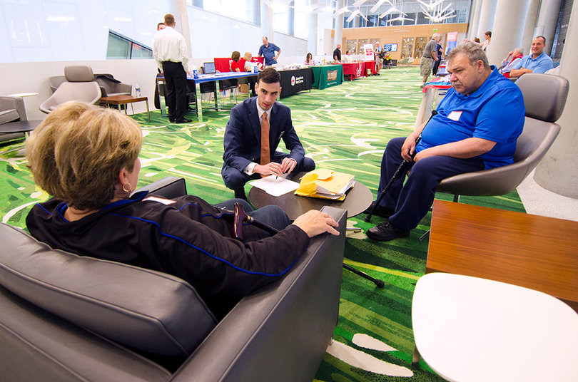 (From Left) Rose Marie Diana, Zachary Johnson and James Diana meet in Dineen Hall during Valor Day on the Syracuse University campus on Saturday.