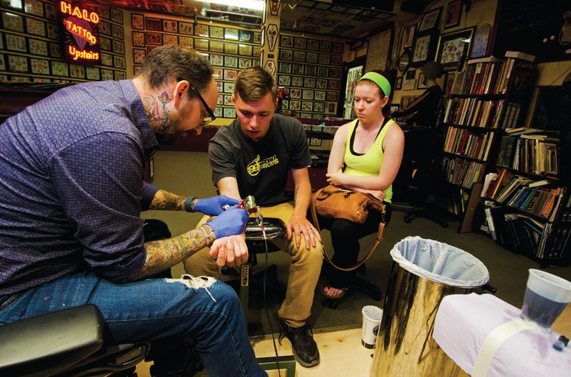 The bill, signed by Gov. Andrew Cuomo, requires all body piercing and tattoo studios to use prepackaged and sterile single-use needles and single-use ink.