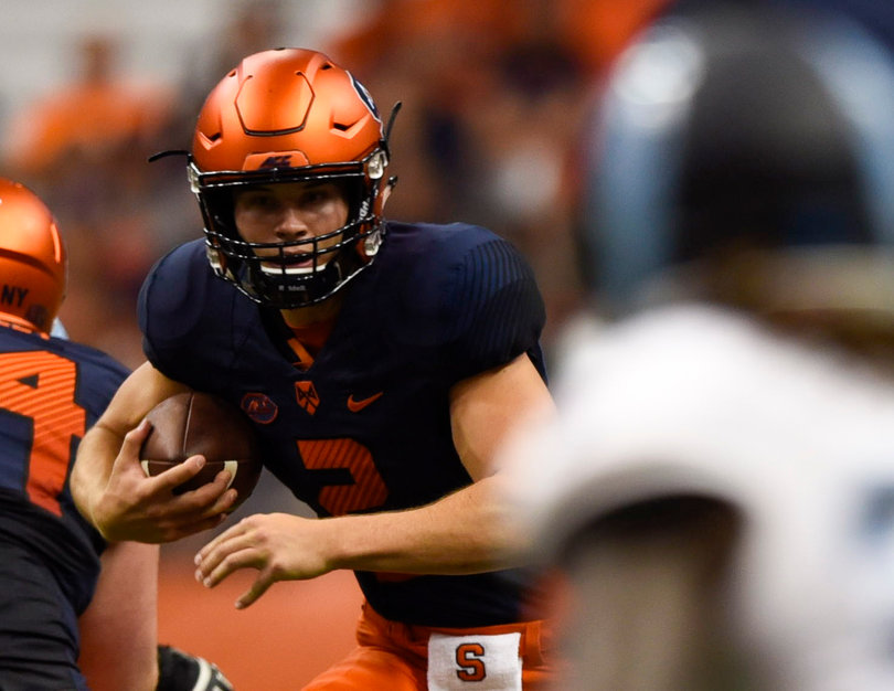 Freshman quarterback Eric Dungey runs with football, amassing a total 20 rushing yards.