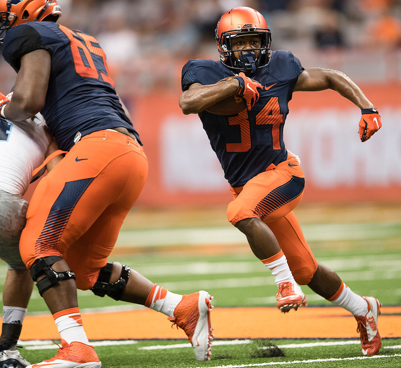 Jacob Hill runs with the football against Rhode Island.