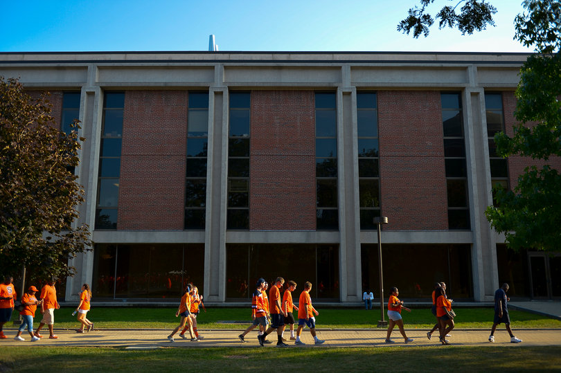 Fans walk towards the Carrier Dome. 