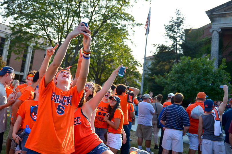 Danny Higgins, a freshman, takes a selfie on the Quad with his friends. 