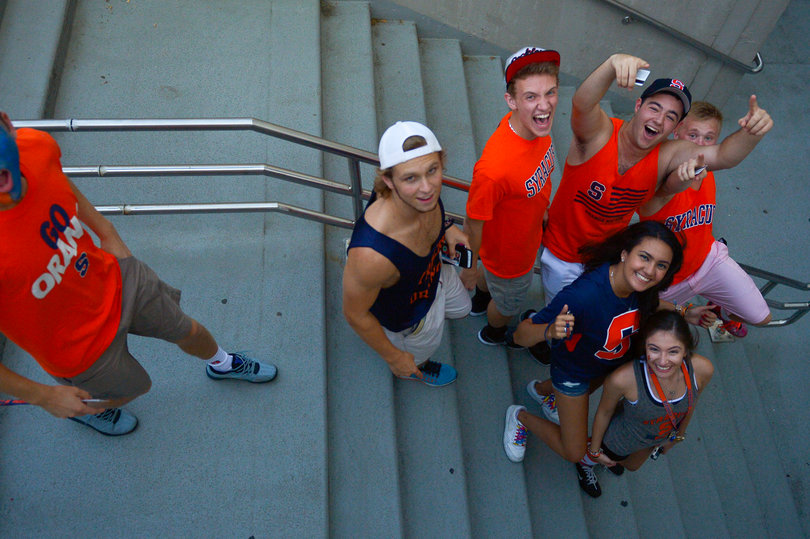 Students cheer before the game as they head into the Dome.