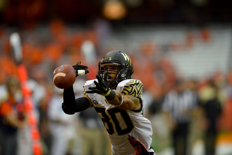 Demon Deacons receiver K.J. Brent reaches out to catch a pass.
