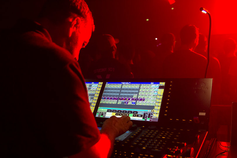The sound board operator makes sure all the audio levels are right. 