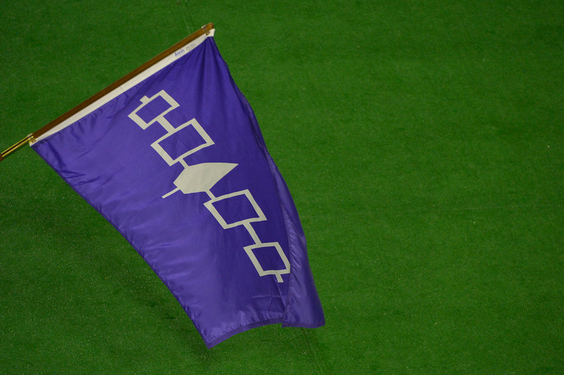 The Iroquois flag waves over the field. The Iroquois Nation is the host country for the event.