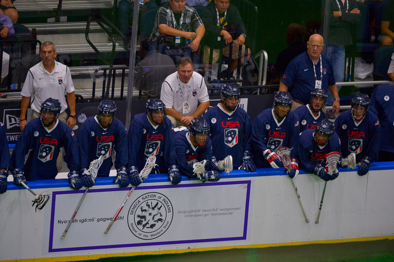 American players and coaches watch the action. After the game, they both said losing to the Iroquois provided an opportunity to learn and improve.