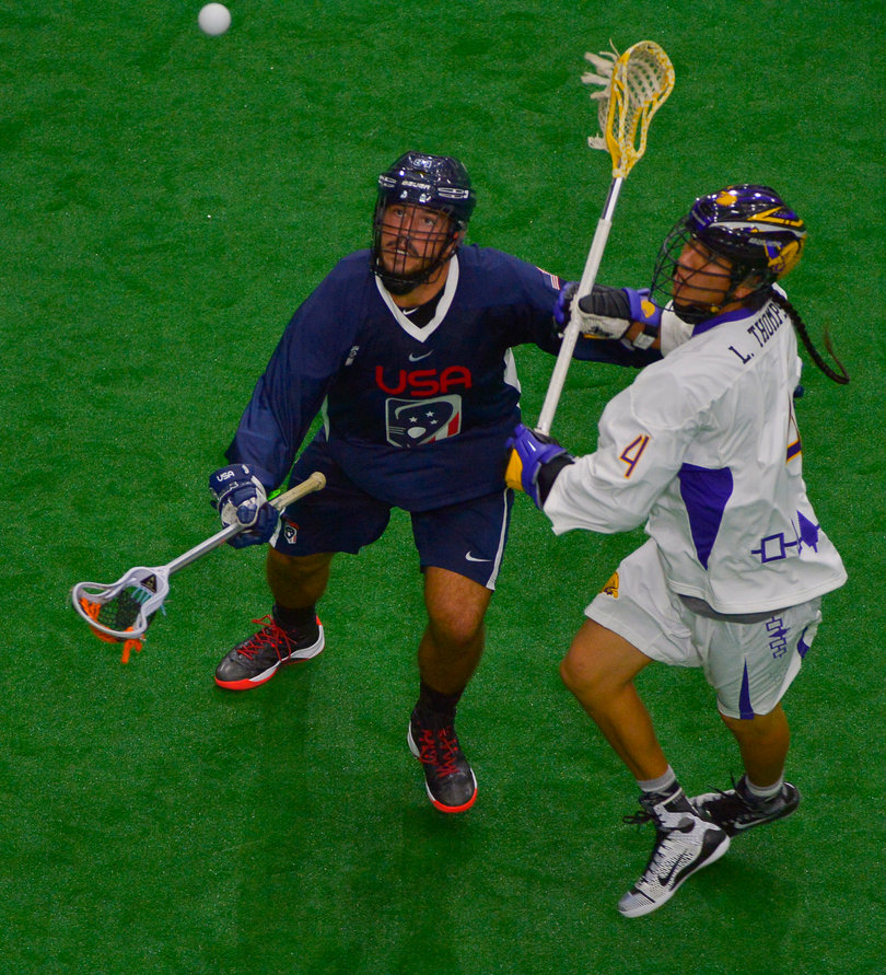 Lyle Thompson goes after a loose ball soaring overhead.