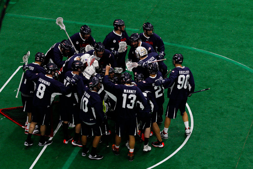 The Americans gather around their own goal to prep for the game.