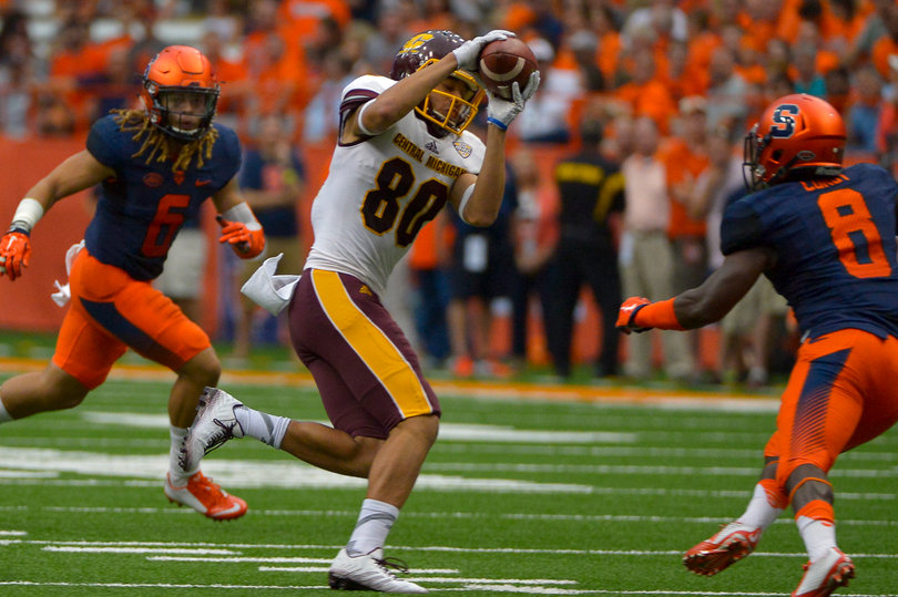 Rodney Williams (left) and Antwan Cordy (right) try to make a tackle on a Central Michigan player.