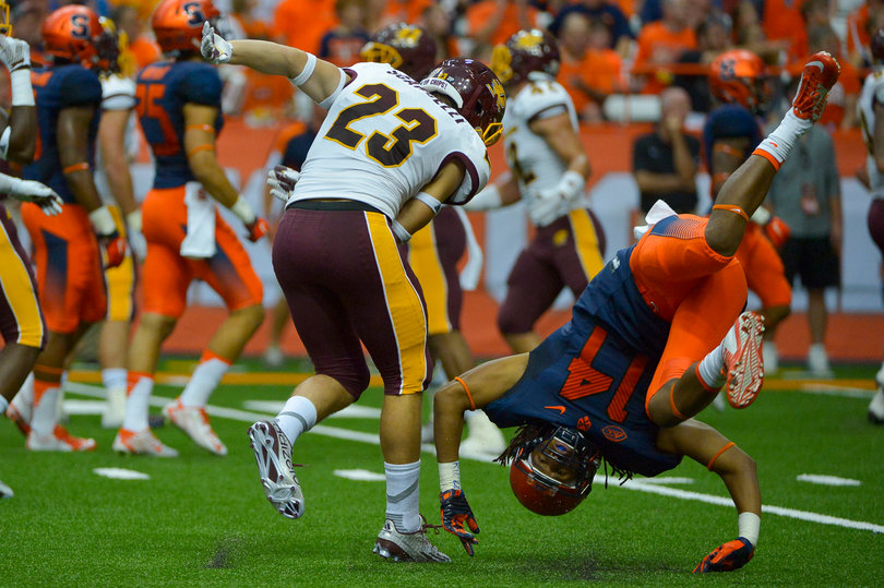 Kenterius Womack is flipped on his side during a special teams play.