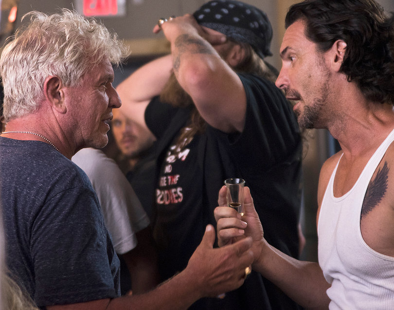 (from left) Berenger and Cangialos share a moment on set. 