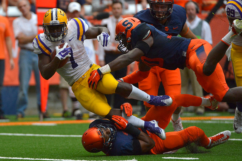 Fournette is tackled by two SU defenders on his way to a 244-yard day. 