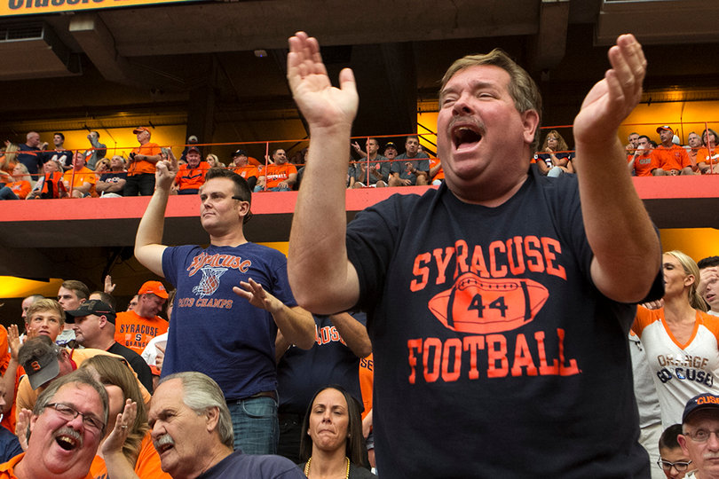 Mike Corbett cheers on SU in its game against No. 8 LSU. Over 43,000 people packed the Carrier Dome on Saturday. 
