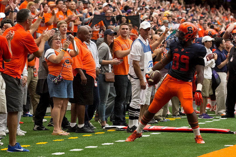 Syracuse tight end Josh Parris reacts to the Orange fans after making a catch.