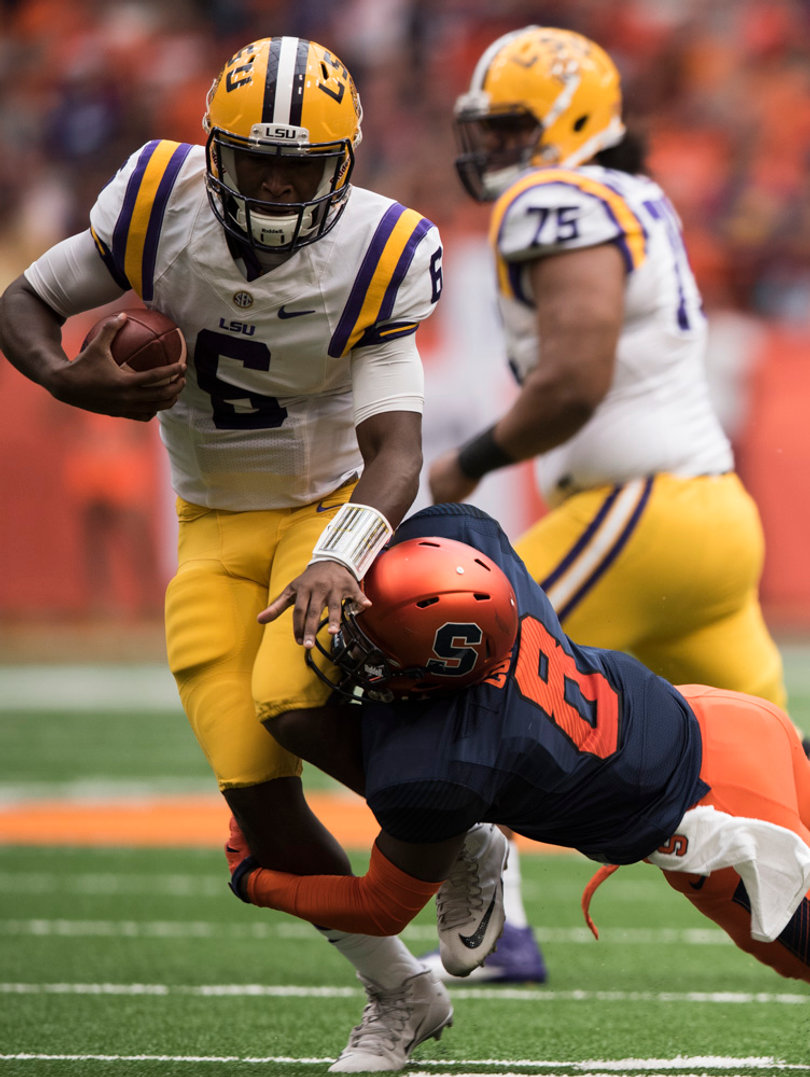 Sophomore Tiger quarterback Brandon Harris gets taken out by Syracuse safety Antwan Cordy.