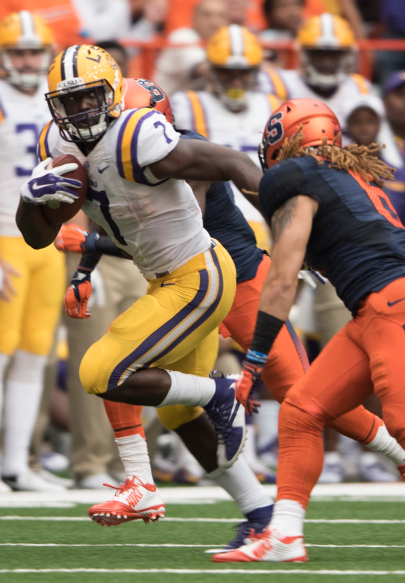 Fournette turns the corner around Orange safety Rodney Williams holding the ball.