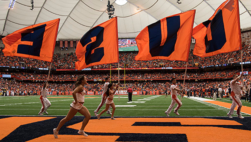 Syracuse flag runners move through the Orange end zone.