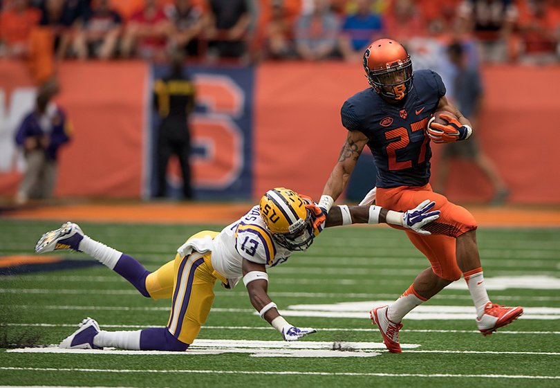 George Morris fends off a defender. He had 35 yards on the ground against the Tigers.