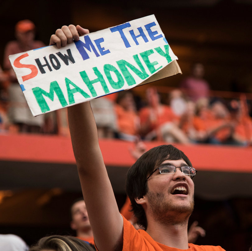 Ben Castaneda, a junior broadcast and digital journalism student, raises a sign referencing Mahoney. 
