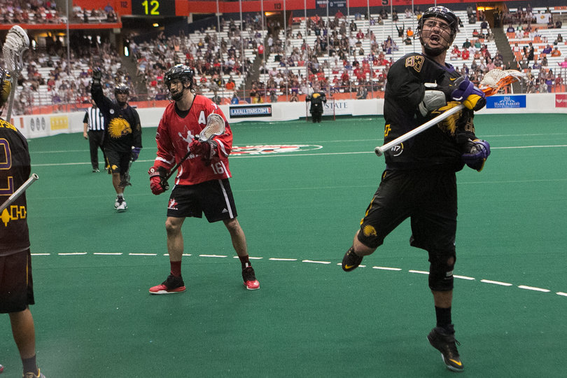 Former Syracuse lacrosse player Randy Staats (83) and the Iroquois celebrate a goal in its 12-8 gold-medal game loss. 
