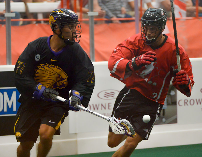 Canadian defender Brett Mydske chases down Iroquois forward Jeff Shattler during the gold-medal game. 