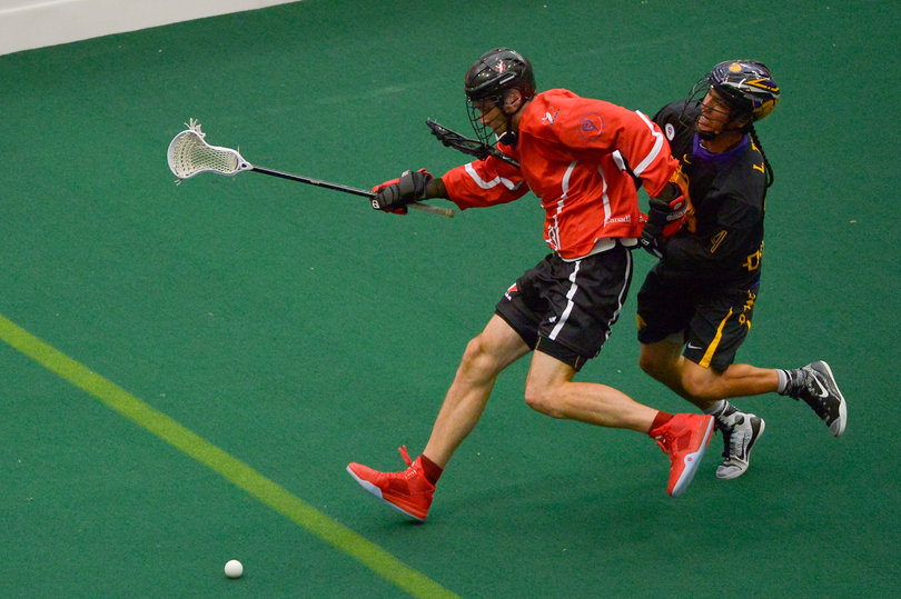 Lyle Thompson (right) gets tangled up with a Canadian player during the Iroquois' 12-8 loss to Canada. 