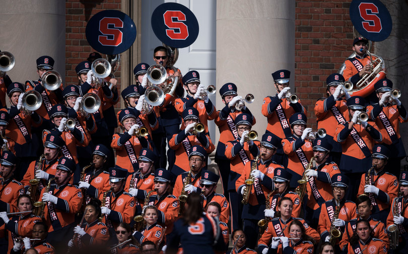 The Syracuse marching band plays for fans before the Syracuse-LSU game on the Quad.