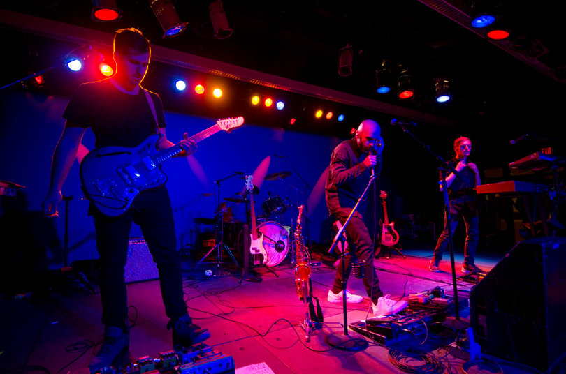 X Ambassadors jam out on stage.