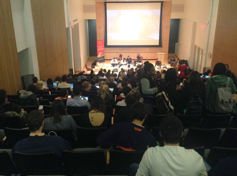 Syracuse University students gather in the Joyce Hergenhan Auditorium inside Newhouse III after the university encouraged students to remain inside.