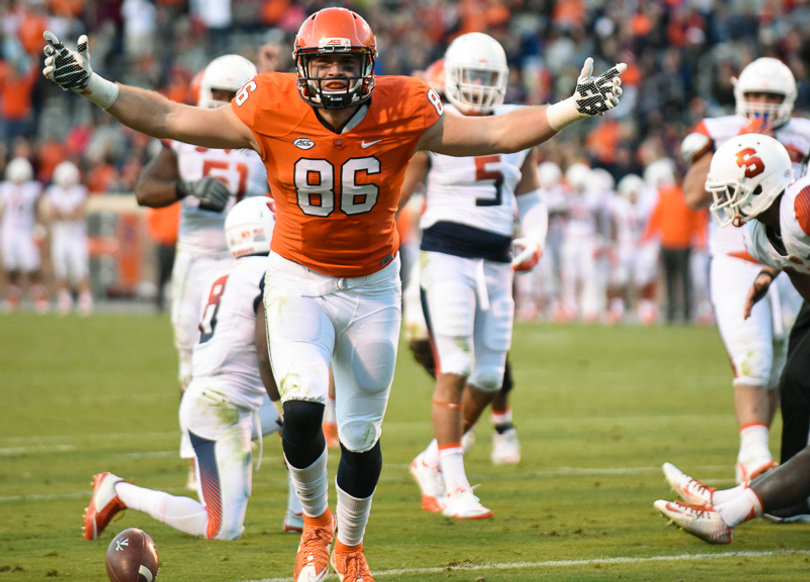 Senior Cavaliers tight end Charlie Hopkins celebrates after beating his touchdown celebration tightened SU's lead to 24-21 in regulation. 