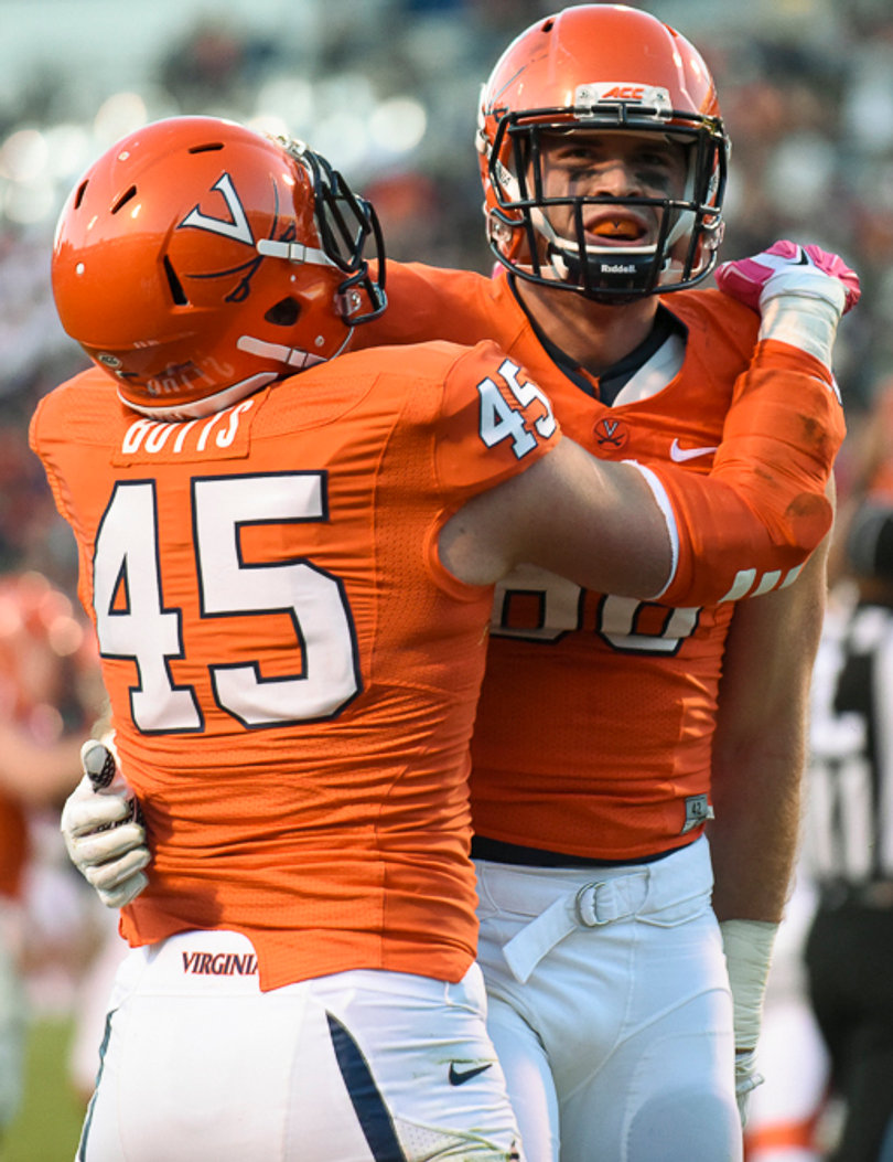 Virginia tight end Evan Butts (45) and wide receiver Ryan Santoro (88) embrace during UVA's 44-38 win. 